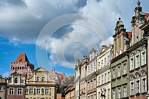Townhouses in the Old Market Square and the tower of the Royal Castle