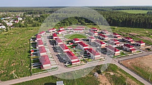 Townhouses in a suburban community, aerial view of new modern cottages.