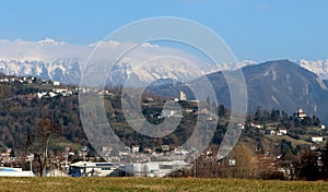 Townscape of Tarcento, near Udine in italy, on its hills. On background the snowed Julian Alps photo