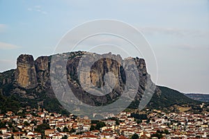 Townscape view of Kalambaka ancient town with beautiful rock formation mountain, immense natural boulders pillars and sky
