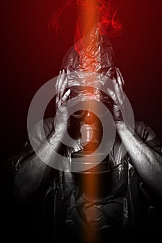 Toxic attack. A man in a gas mask in the smoke. artistic background