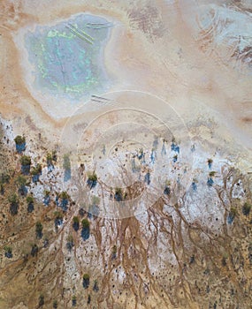 Toxic copper mine dumps surface, aerial view directly above photo