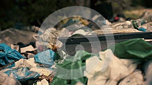 Toxic garbage lying on the ground, problems of recycling, environmental concerns