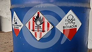 Toxic hazardous waste signs affixed to containers