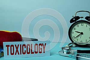 Toxicology Planning on Background of Working Table with Office Supplies. Medical and Healthcare Concept Planning on White