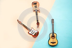 Toy acoustic, electric and bass guitars