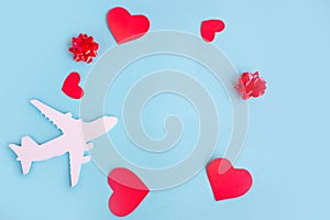 Toy airplane on blue table with red heart