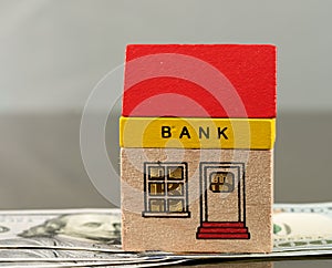 Toy bank building on US dollar assets