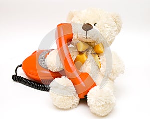Toy bear with old telephone