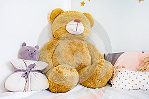Toy bears lying on bed in sleeping room. Child concept