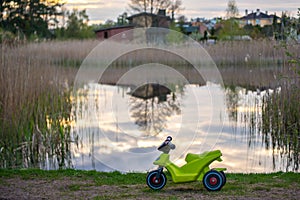 Toy bike near lake