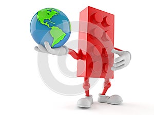 Toy block character holding world globe