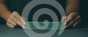 Toy block with the text self-confidence, web banner