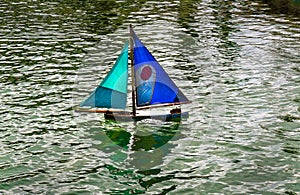 Toy Boat on Pond