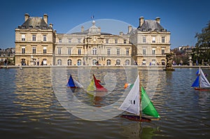 Toy boats in a fountain in Paris photo