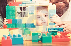 Toy brick wall with window and door and kid