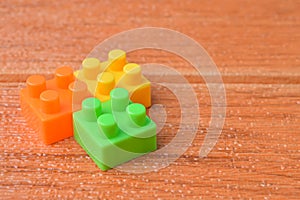 Toy building blocks isolated on a brown background