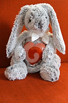 Toy bunny with a heart.  Preparation for a romantic holiday at home. Valentines Day, Birthday  and love Concept