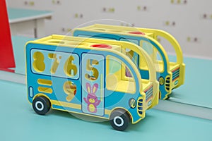 Toy bus, multicolor car wooden blocks, transport over sky background . wooden toy bus