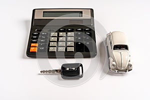 Toy car and calculator with calculations, the concept of selling and buying car