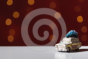 Toy car carrying a Christmas tree