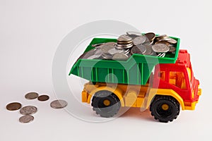 A toy car is carrying a full load of coins..
