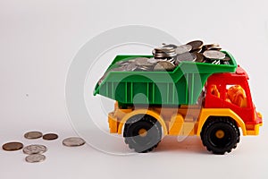 A toy car is carrying a full load of coins..