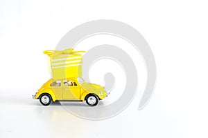 Toy car with gift box on white background with copy space. New year concept - Kiev, Ukraine, 2 October 2020