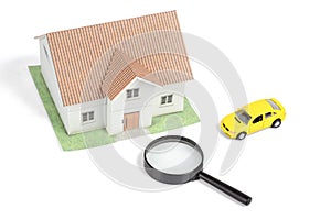 Toy car and house with magnifier