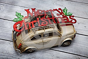 Toy car with Merry Christmas sign