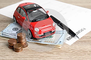 Toy car, money and insurance contract
