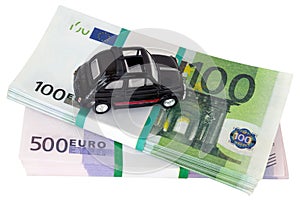 Toy car on money