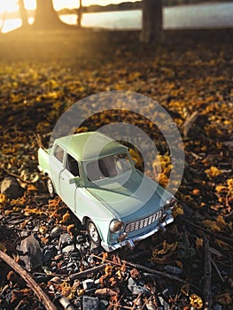 Toy car on the road nature background ,vintage filter