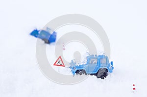 Toy car stucked in a snowbank