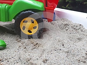 toy car wheel in the sand. Sand toys for children