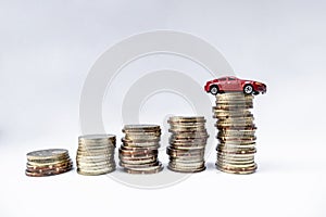 Toy cars with gold coins show To growth, saving money for car loans