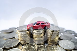 Toy cars with gold coins show To growth, saving money for car loans