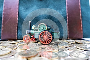 Toy cars with gold coins show To growth, saving money for car loans