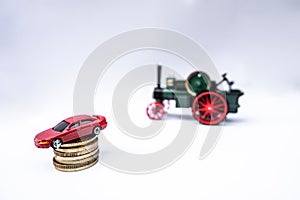 Toy cars with gold coins show To growth, saving money for car loans