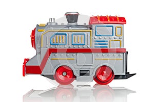 Toy children`s steam locomotive, battery-powered gray train, electric, isolated on a white background, side view