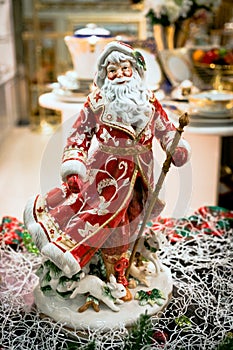 Toy christmas decor and decorations for home. merry santa dancing and spinning in the dance. macro photo.