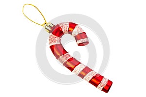 Toy for Christmas tree branches in the shape of a candy cane. Lollipop stick with red and white twisted stripes, isolated