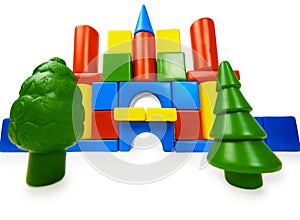 Toy colored castle and plastic trees