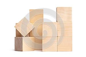 Toy constructor made of natural wooden blocks of cubic shape. Isolate on a white background