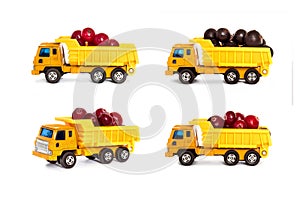 Toy dump trucks loaded with berries