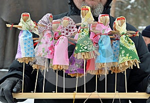 Toy effigies of Shrove Tuesday made of straw on wooden stand at Maslenitsa Butter Lady, Butter Week, Crepe week, or Cheesefare We