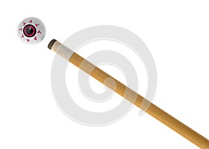 Toy eyeball on a white background with pool cue