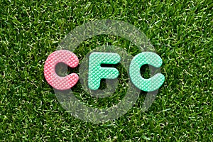 Toy letter in word CFC abbreviation of Chlorofluorocarbon on green grass background