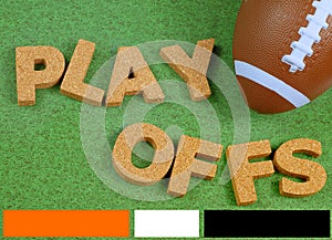 Toy football on grass background with red white and blue color bars across the bottom to match a football league team.