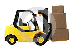 Toy forklift with boxes isolated. Logistics and wholesale concept